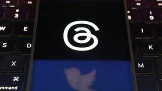 Twitter and Threads logos are displayed on a cell phone (Justin Sullivan/Getty Images)