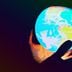 globe held in someone's hand (Greg Rosenke/Unsplash, modified by CoinDesk)