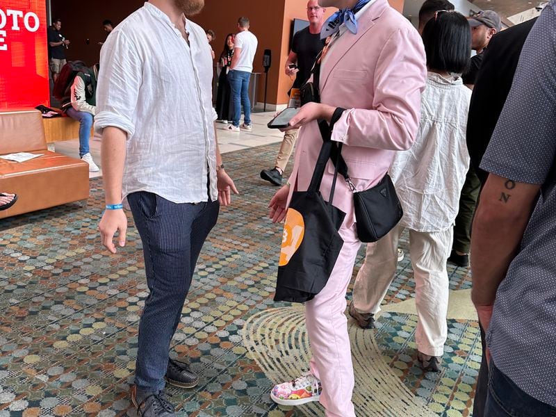 Bitcoin Nashville conference attendee in pink suit (Bradley Keoun)