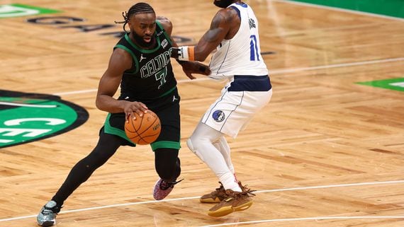 Jaylen Brown of the Boston Celtics drives around Kyrie Irving of the Dallas Mavericks during the fourth quarter in Game Two of the 2024 NBA Finals in Boston. (Photo by Maddie Meyer/Getty Images)