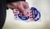 DENVER, COLORADO - MARCH 5: An election judge holds "I Voted" stickers while collecting drive-thru ballots on March 5, 2024 outside the Highland Recreation Center in Denver, Colorado. 15 States and one U.S. Territory hold their primary elections on Super Tuesday, awarding more delegates than any other day in the presidential nominating calendar.  (Photo by Marc Piscotty/Getty Images)