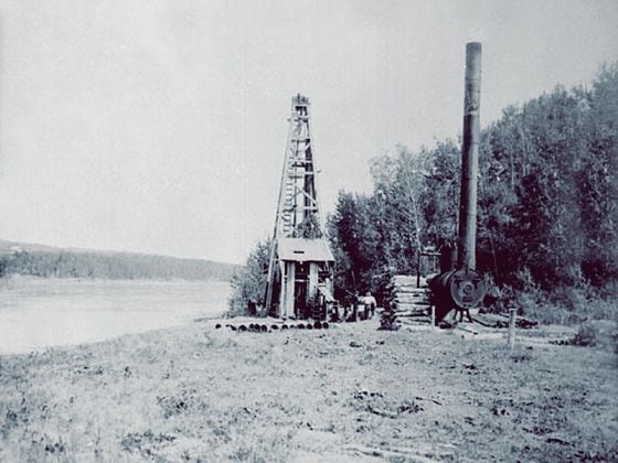 An early oil derrick from Alberta, Canada, 1898. (Wikipedia, modified by CoinDesk)