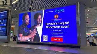 Polygon co-founder Sandeep Nailwal in an ad at Istanbul's airport (Amitoj Singh/CoinDesk)