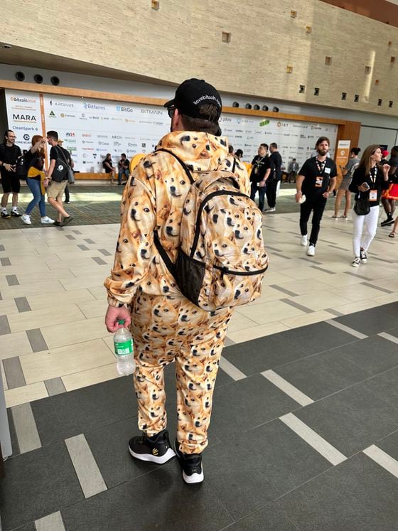 Conference attendee wearing Dogecoin track suit (Bradley Keoun)