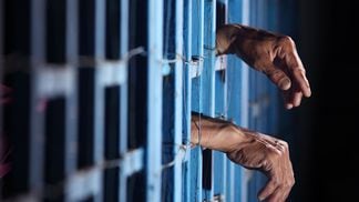 53955647 - prisoner in jail  (Shutterstock)