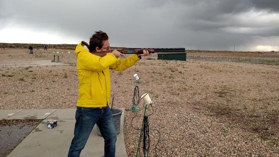 Compound founder Robert Leshner shoots a shotgun. (Robert Leshner)
