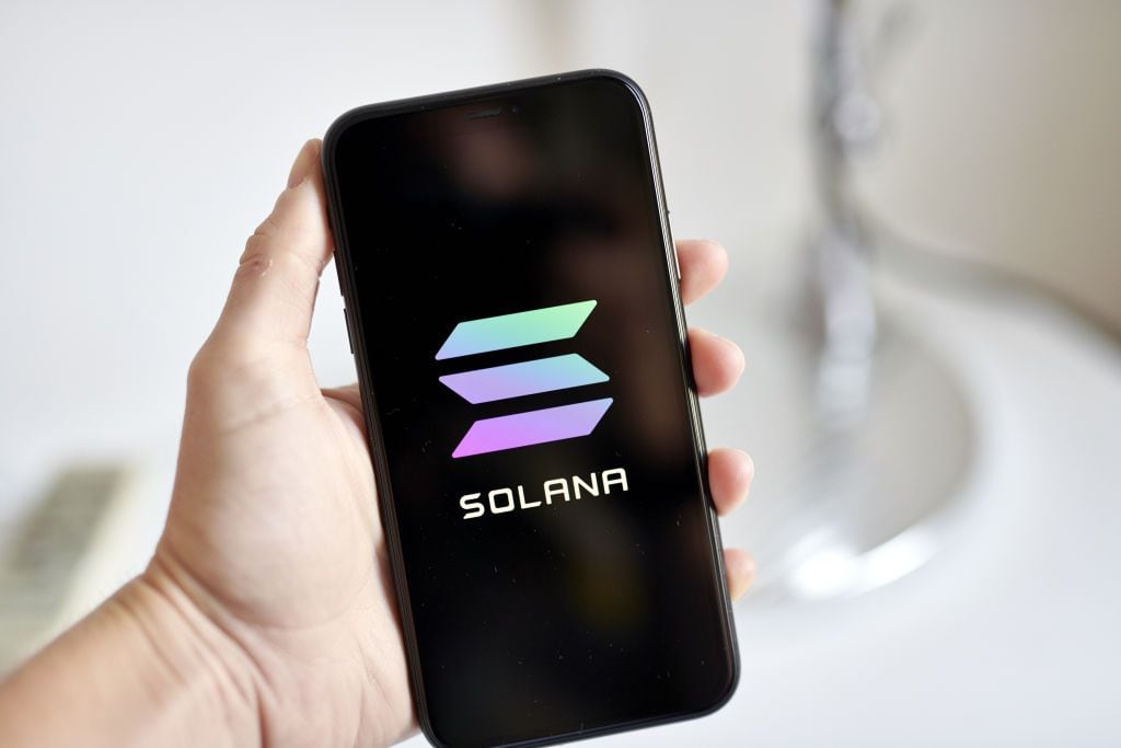 Solana logo on a smartphone arranged in the Brooklyn Borough of New York, U.S., on Saturday, July 31, 2021. The Senate's bipartisan infrastructure deal envisions imposing stricter rules on cryptocurrency investors to collect more taxes to fund a portion of the $550 billion investment into transportation and power systems. Photographer: Gabby Jones/Bloomberg via Getty Images