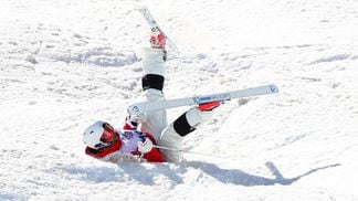 SIERRA NEVADA, SPAIN - MARCH 09:  Ikuma Horishima of Japan crashes before going on to win the gold medal in the Men's Dual Moguls on day two of the FIS Freestyle Ski and Snowboard World Championships 2017 on March 9, 2017 in Sierra Nevada, Spain.  (Photo by Clive Rose/Getty Images)