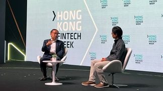 Hong Kong FSTB Secretary Christopher Hui talks to co-founder of Animoca Brands Yat Siu at Hong Kong FinTech Week. (Lavender Au/CoinDesk)