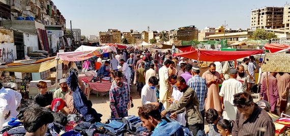Karachi, Pakistan - Nov 14, 2021: People are seen at a weekly Sunday bazaar in Bufferzone, an area of central Karachi of Sindh province in Pakistan
