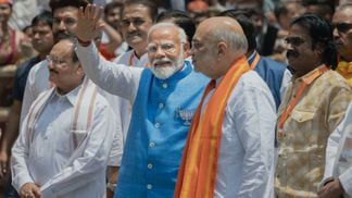 Narendra Modi greets supporters in May. (Elke Scholiers/Getty Images)