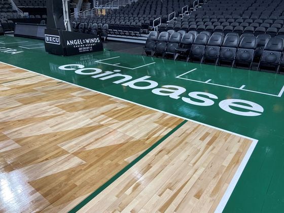Coinbase logo on the home court of the Seattle Storm (Seattle Storm)