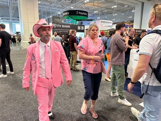 Bitcoin Nashville conference attendee in pink suit (Bradley Keoun)